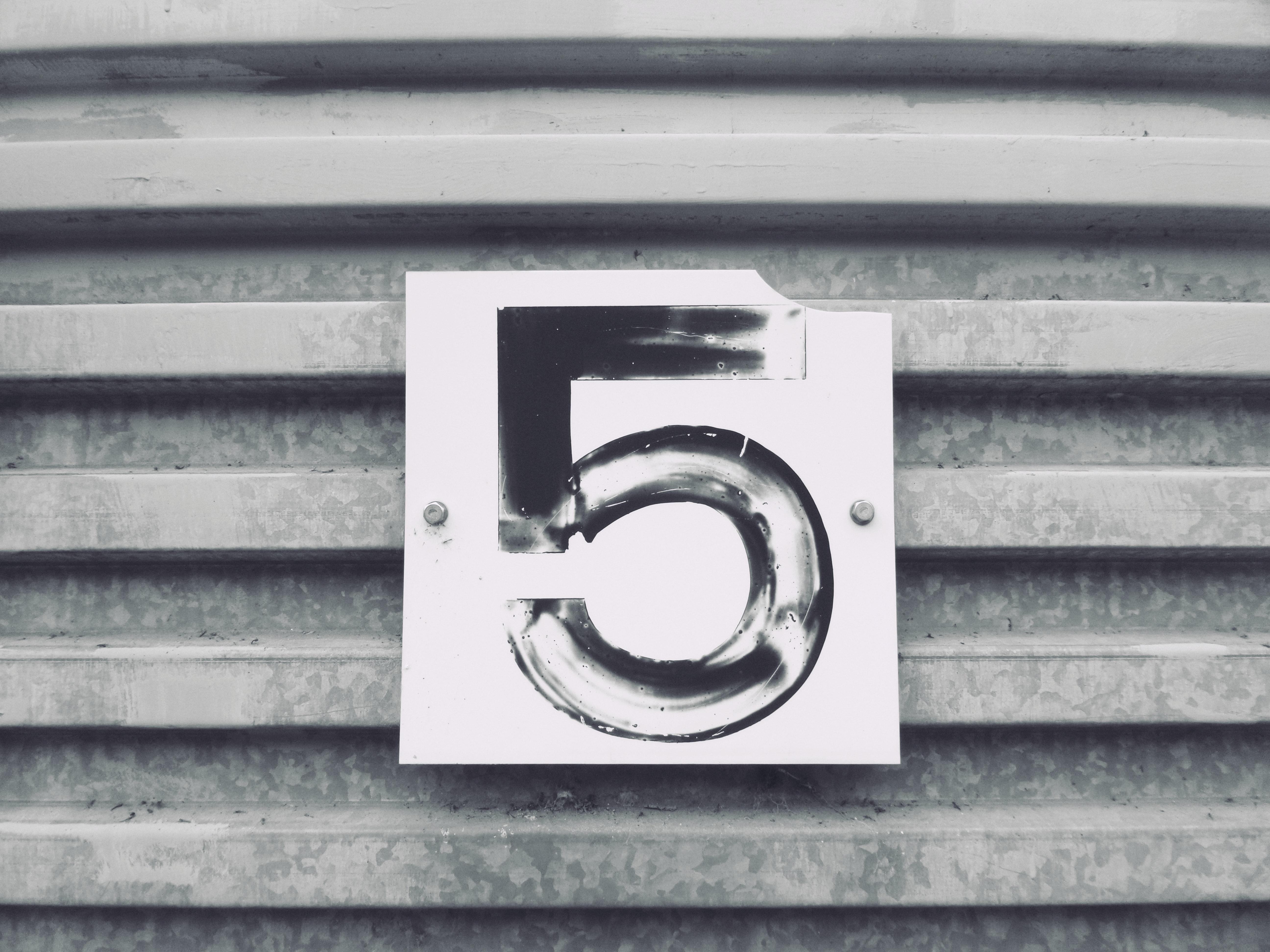 The number 5 on a sign