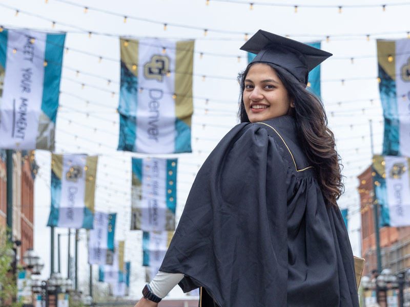 CU Denver graduate posing in Larimer Square