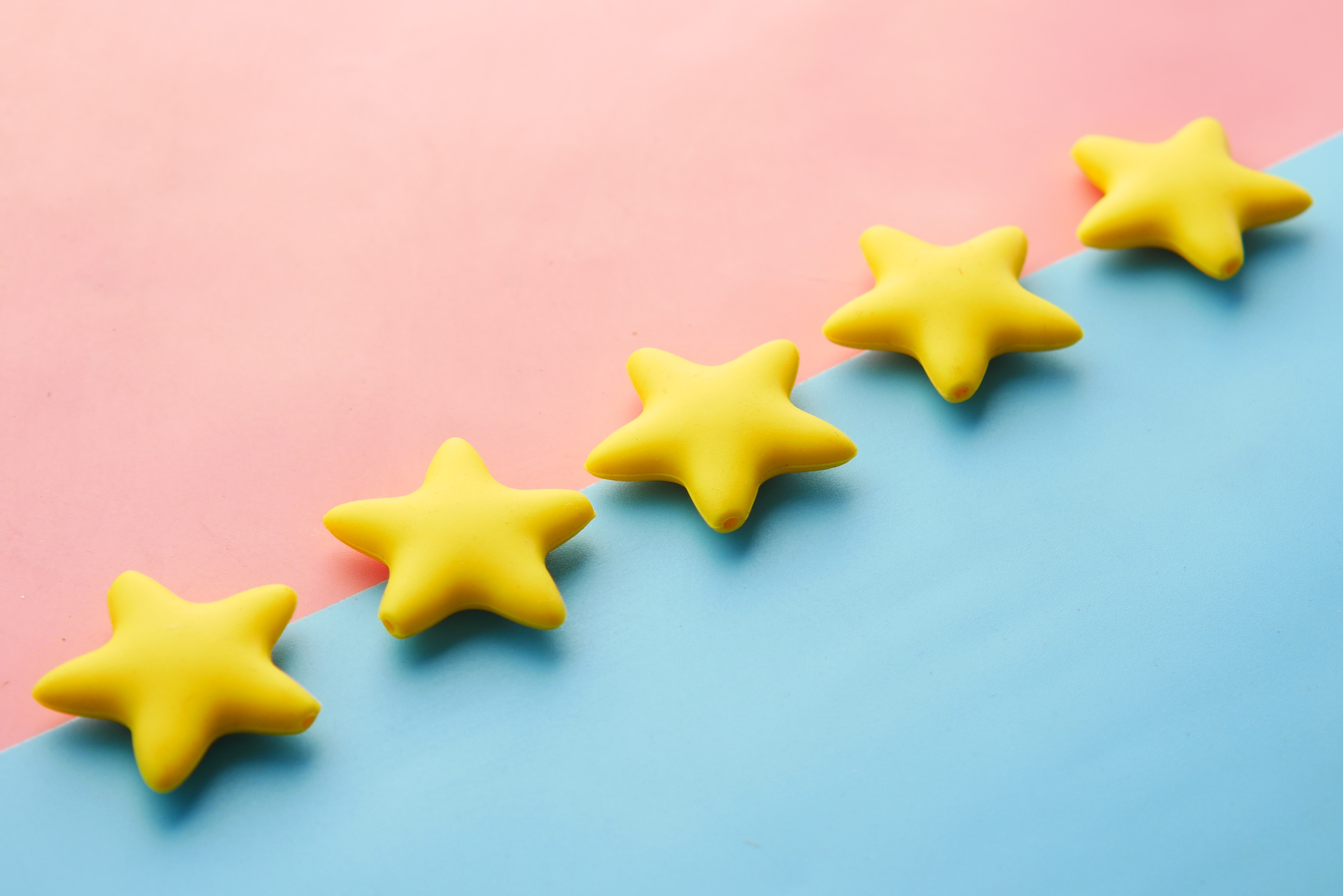 Gold stars on pink and blue background