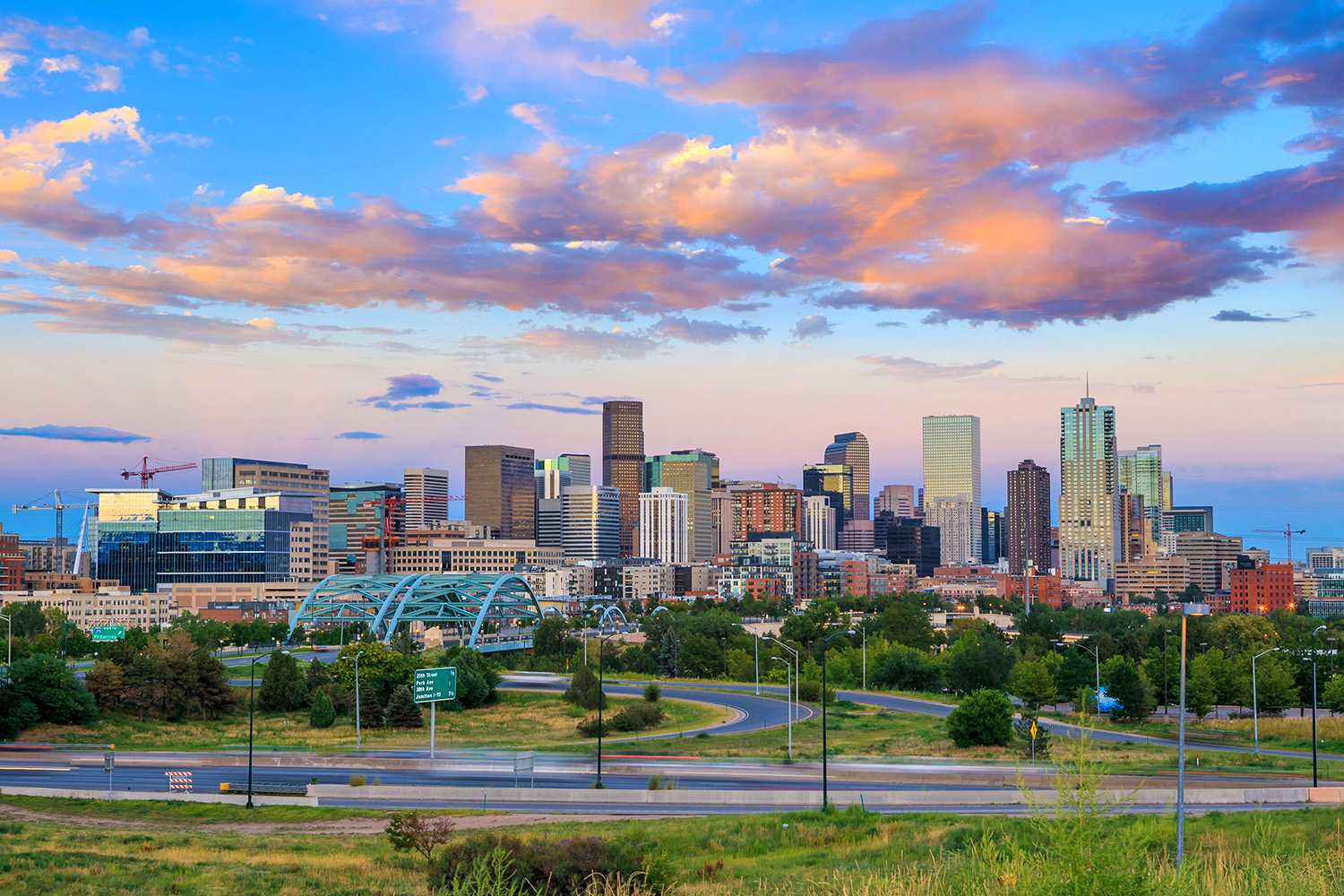A Photograph of Denver with a Panoramic Skyline View including Sky and Clouds
