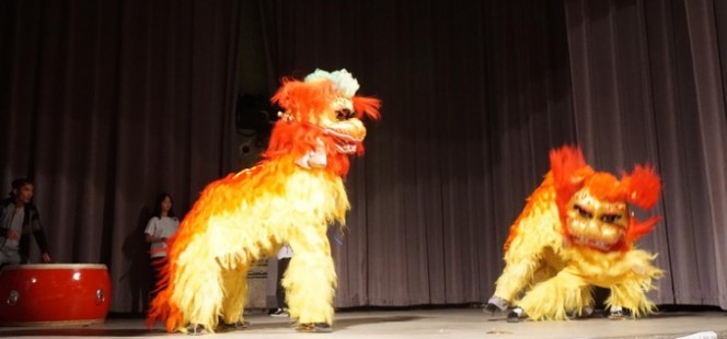 actors in lion costumes on stage