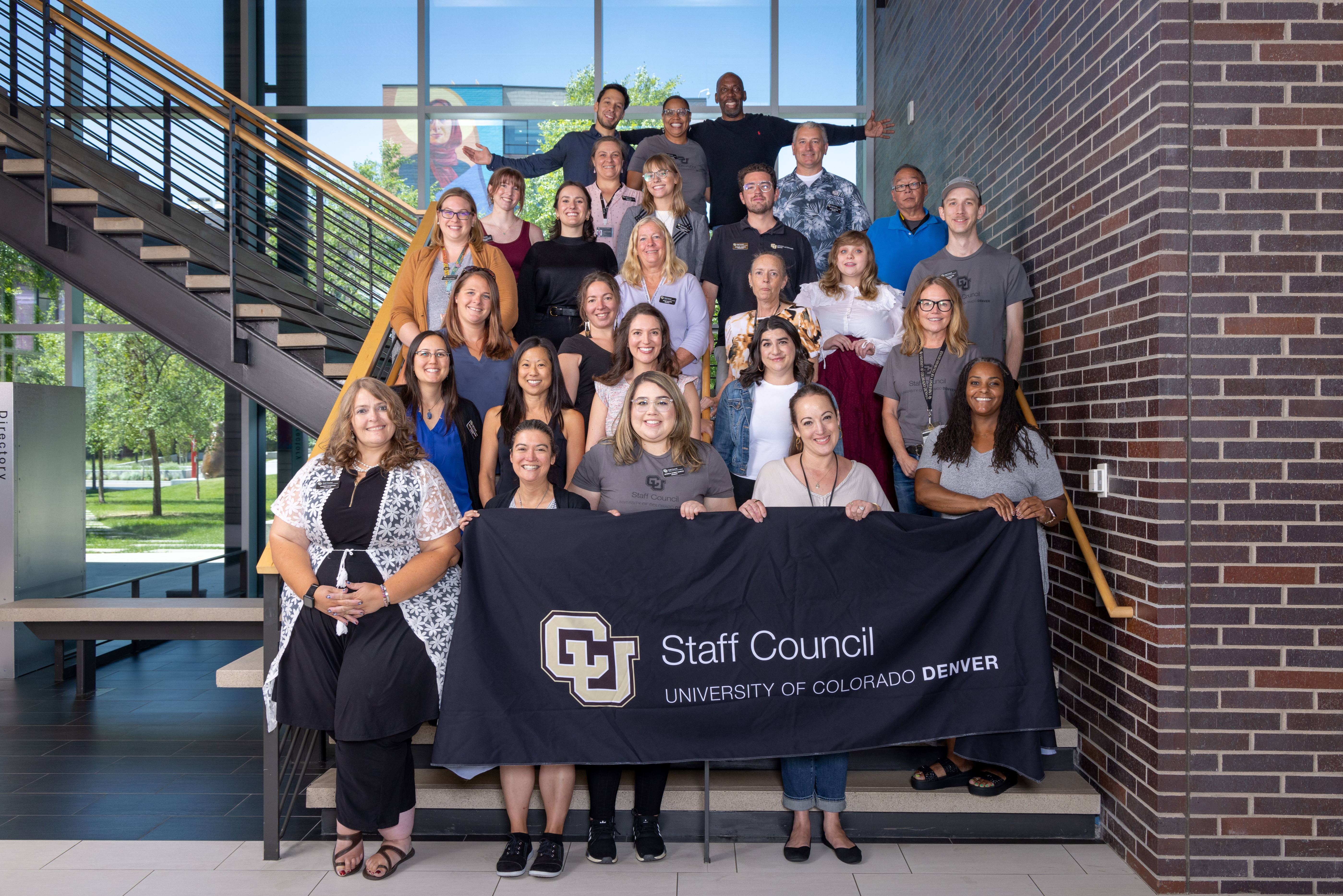 Staff council members standing in the student commons