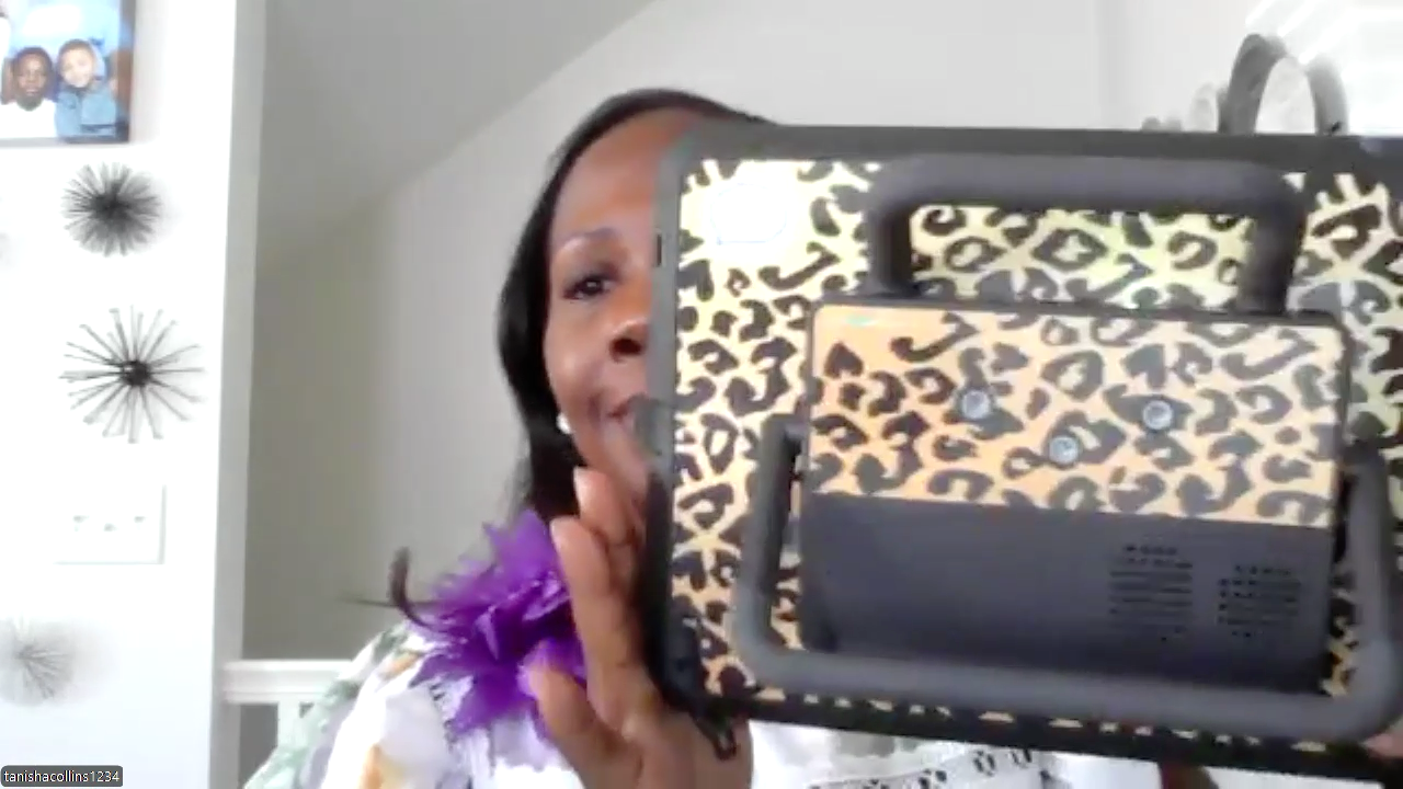 Tanisha shows off the animal print case on her AAC device.